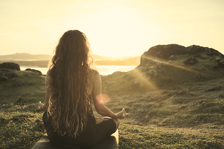 22222_woman-meditating-yoga-alone-at-sunrise-mountains-v-XAH9MB7